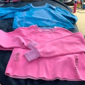 The blue is size small the pink is extra small brand is BDG